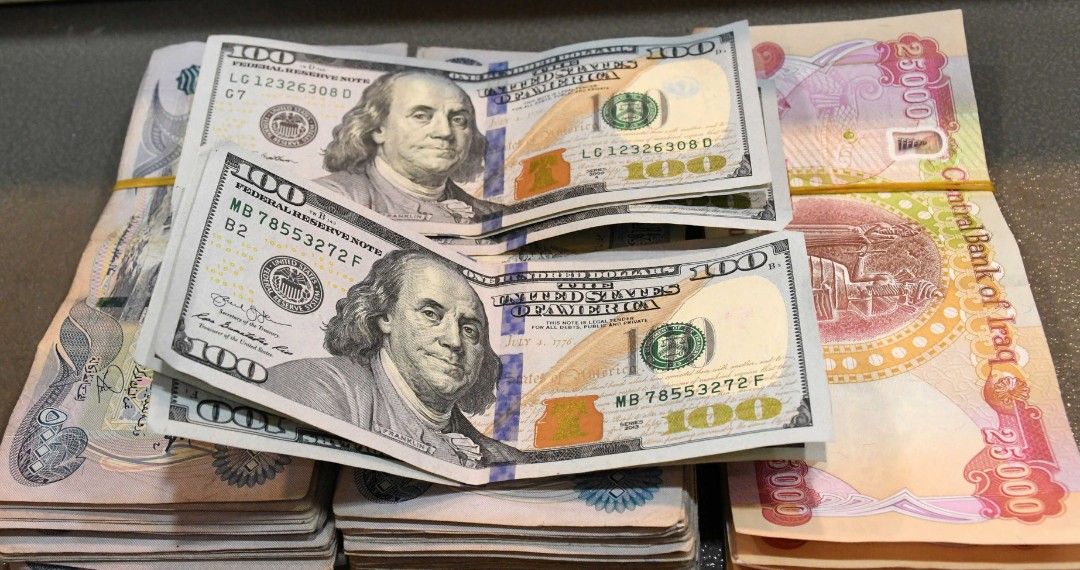 سعر صرف 100 دولار بالدينار العراقي